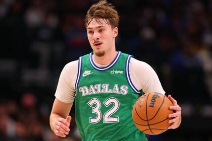 Cooper Flagg dribbling a basketball during a game against the Los Angeles Lakers