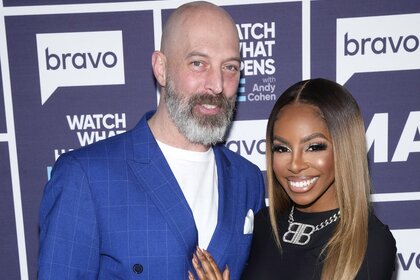 Chris Bassett and Candiace Dillard smile together on Watch What Happens Live With Andy Cohen Episode 2140.