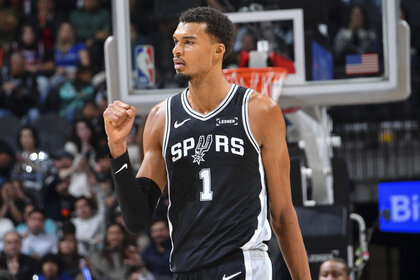 Victor Wembanyama, #1 of the San Antonio Spurs, celebrating during a game against the New York Knicks.