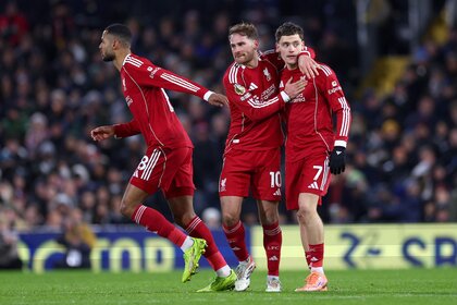 Florian Wirtz of Liverpool celebrates scoring his team's first goal with teammates Alexis Mac Allister and Cody Gakpo.