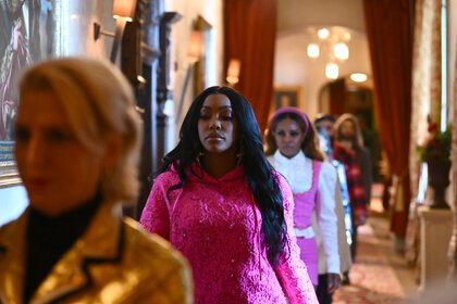 Dorinda Medley, Porsha Williams, and Candiace Dillard Bassett walking down a hall in The Traitors Season 4.