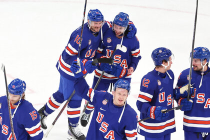 Quinn Hughes and JT Miller of the Men's Hockey Team USA celebrating his victory goal