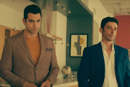 Samuel and Elias standing next to each other in M.I.A. Season 1 Episode 2.