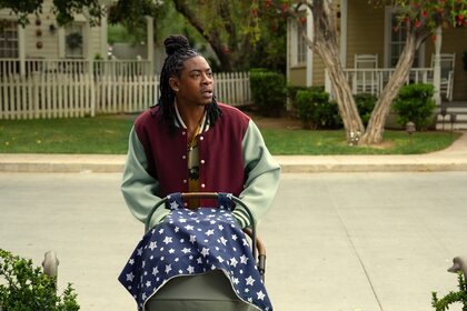 Lanston (RJ Cyler) pushes a stroller on The 'Burbs Episode 106.