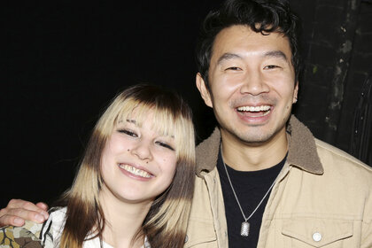 Alysa Liu and Simu Liu pose and smile together.