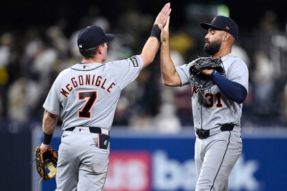 Kevin McGonigle and Riley Greene high-five after defeating the San Diego Padres.
