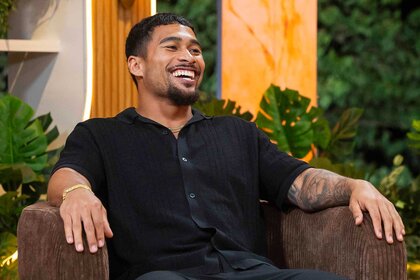 Sean David Reifel laughing on a couch during Love Island USA Season 8 Episode 10.
