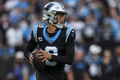 Bryce Young, #9 of the Carolina Panthers, prepares to throw the ball during a game.