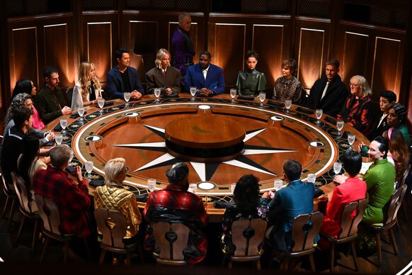 The cast of The Traitors gather around a giant round table on Episode 401