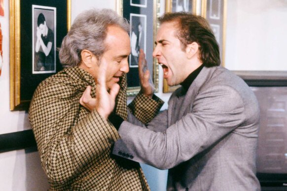 Nicolas Cage yelling at Lorne Michaels while pinning him against a wall during Saturday Night Live Season 18 Episode 1.