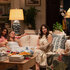 The full cast of The Five Star Weekend Season 1 seen sitting in a cosy living room.