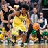 Takai Simpkins of the Oregon Ducks brings the ball up court during the first half against the Michigan State Spartans.