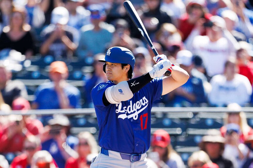 Shohei Ohtani of the Los Angeles Dodgers at bat during the spring training game against the Los Angeles Angels.