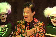 David S. Pumpkins smiles with his skeleton boys