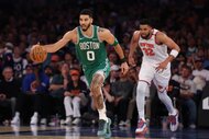 Jayson Tatum of the Boston Celtics dribbles against the New York Knicks.