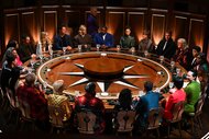 The cast of The Traitors gather around a giant round table on Episode 401
