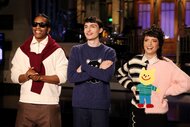 A$AP Rocky, host Finn Wolfhard, and Sarah Sherman stand next to each other and smile for SNL Episode 5110.