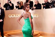 Olandria Carthen in a green gown on the red carpet of at the 83rd Annual Golden Globe Awards.