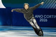 Ilia Malinin skating on the ice during the Milano Cortina 2026 Winter Olympics.