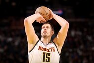 Nikola Jokic of the Denver Nuggets shoots a free throw during the game against the Golden State Warriors.
