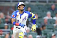 Ronald Acuna Jr. of the Atlanta Braves reacts after hitting the baseball during the MLB game between the Pittsburg Pirates and the Atlanta Braves.