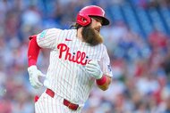 Brandon Marsh of the Philadelphia Phillies runs to first against the Chicago Cubs.