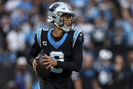 Bryce Young, #9 of the Carolina Panthers, prepares to throw the ball during a game.
