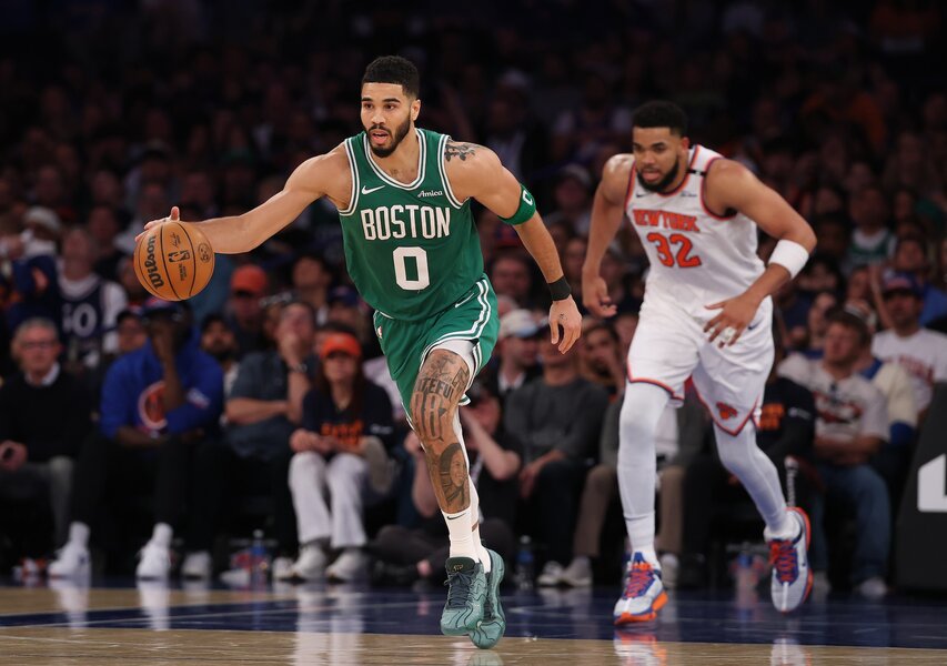 Jayson Tatum of the Boston Celtics dribbles against the New York Knicks.