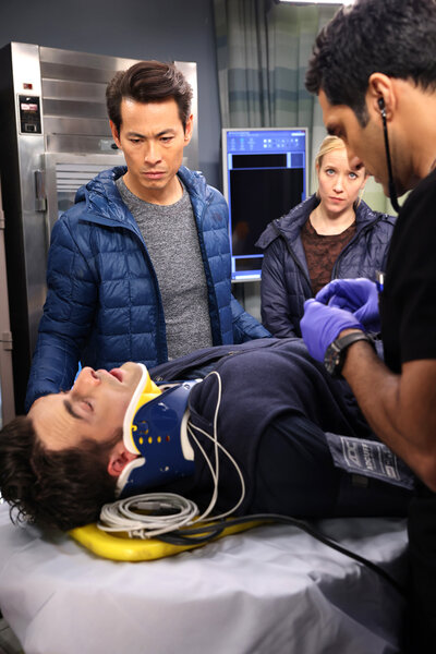 Omar Thomas (Corey Cott) getting treated in a hospital room during Chicago Med Season 8 Episode 11.
