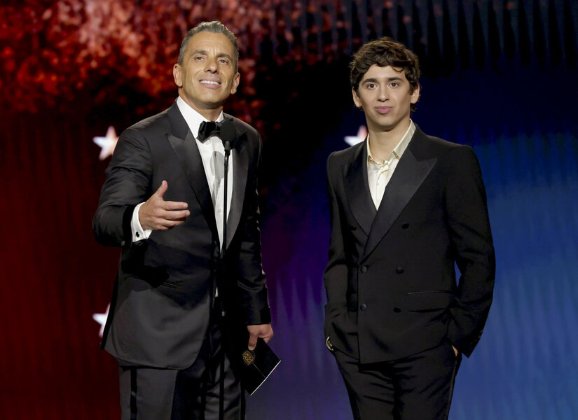 Sebastian Maniscalco and Marcello Hernández talking onstage at the 31st Annual Critics Choice Awards.