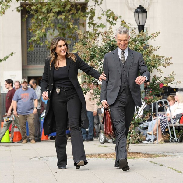 Mariska Hargitay and Peter Scanavino walking together at the Law and Order: Special Victims Unit set.