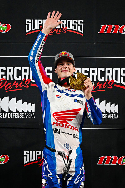 Jett Lawrence of Australia celebrates on the podium during the Supercross 2023 Freestyle motocross.
