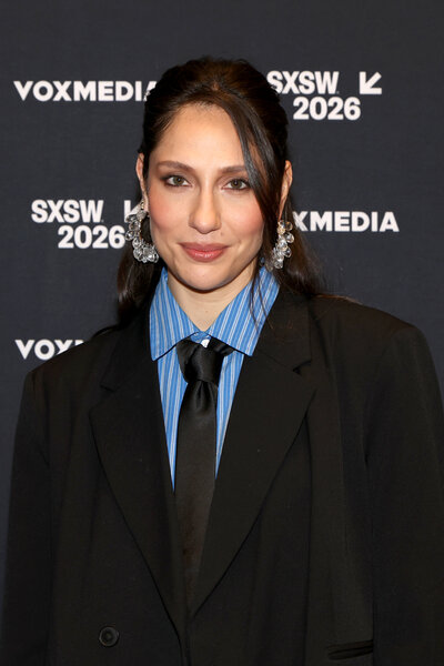 Tefi Pessoa wears a suit while attends the Vox Media Podcast Stage at SXSW.
