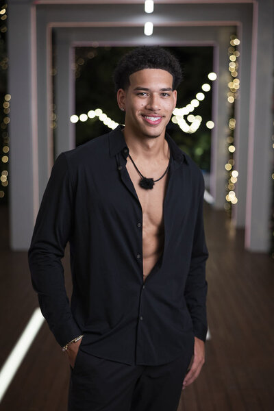 Corbin Mims wearing a black button down shirt on Love Island Season 8.