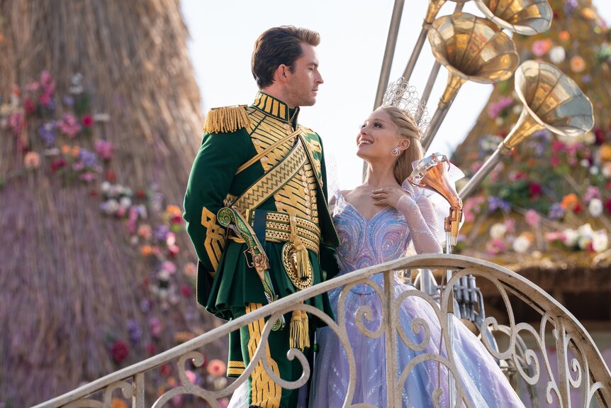 Glinda (Ariana Grande) smiles while looking up at Fiyero (Jonathan Bailey) in Wicked For Good (2025).