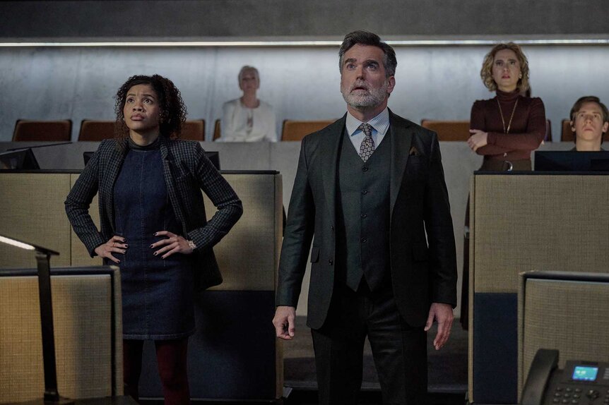 Parker, Ellie, and Peter Moira standing and looking up in The Copenhagen Test Season 1 Episode 5.