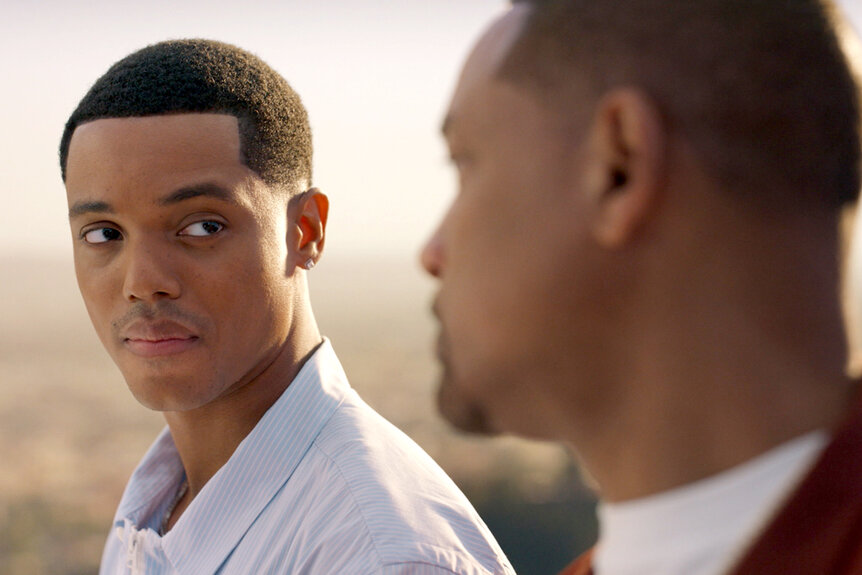 Will (Jabari Banks) and Will Smith standing outside facing each other and having a conversation together