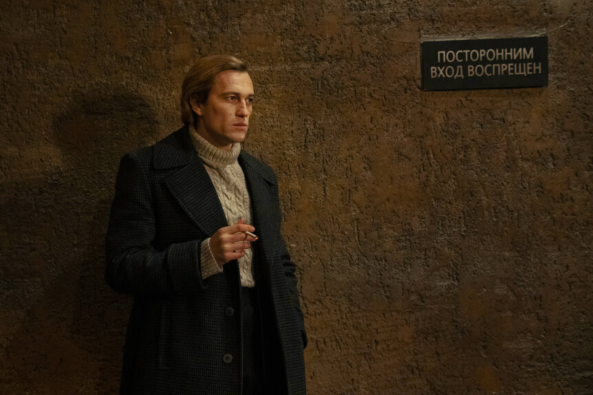 Andrei smoking outside in PONIES Season 1 Episode 2.