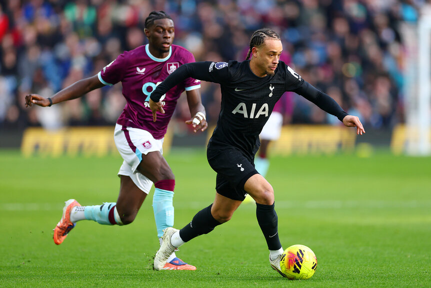 Lesley Ugochukwu of Burnley and Xavi Simons of Tottenham Hotspur running with the ball during the Premier League match between Burnley and Tottenham Hotspur.