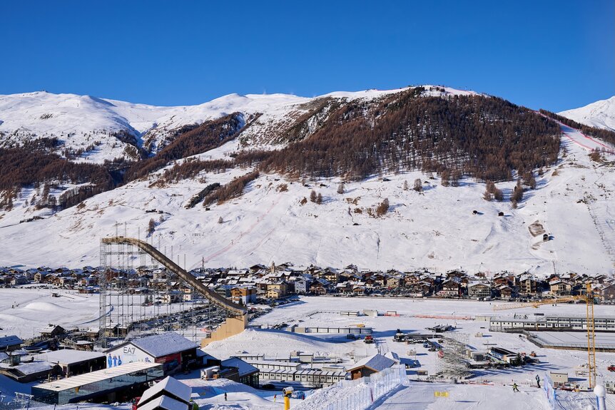 Ski slopes and jumps are constructed for the Milano Cortina 2026 Winter Olympics.