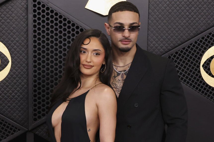 Leah Kateb and Miguel Harichi pose together on the The 68th Annual Grammy Awards red carpet.