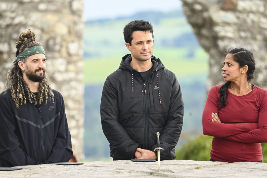 Mark Ballas, Stephen Colletti, and Natalie Anderson standing together in The Traitors Season 4 Episode 7.