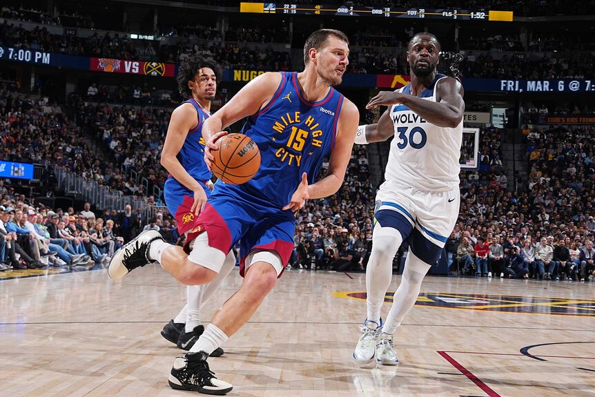 Nikola Jokic of the Denver Nuggets drives to the basket during the game against the Minnesota Timberwolves.