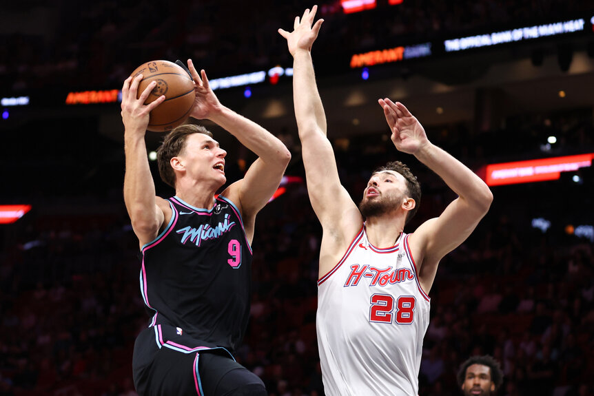 Pelle Larsson of the Miami Heat drives against Alperen Sengun of the Houston Rockets