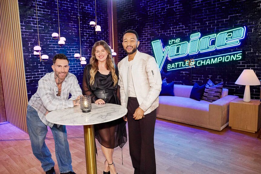 Adam Levine, Kelly Clarkson, and John Legend posing together on The Voice Season 29 Episode 7.