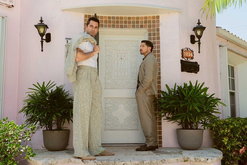 Samuel and Mateo standing in front of a pink doorway in M.I.A. Season 1 Episode 3.