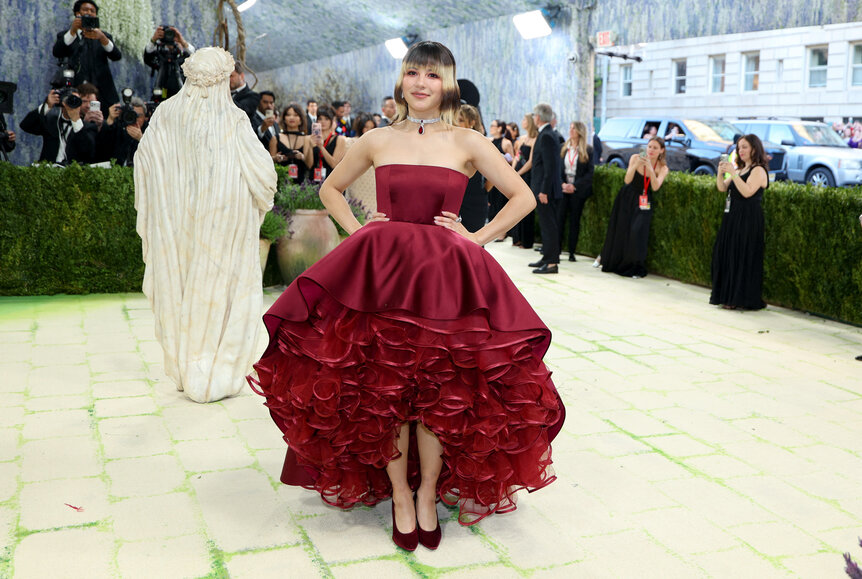 Alysa Liu Met Gala arriving at the 2026 Met Gala wearing a deep red gown.