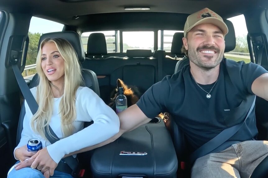 Steven McBee Jr. and Allie Eklund holding hands and sitting in a car together.