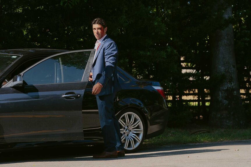 Elias standing outside a car in M.I.A. Season 1.