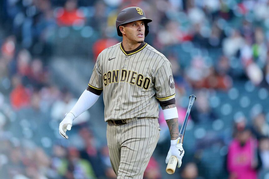 Manny Machado of the San Diego Padres walks back to the dugout after striking out against the San Francisco Giants.